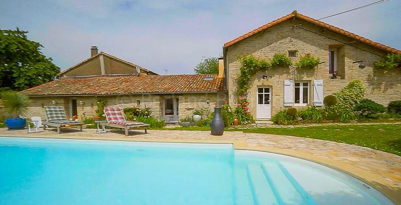 Character stone property with heated pool + pretty garden