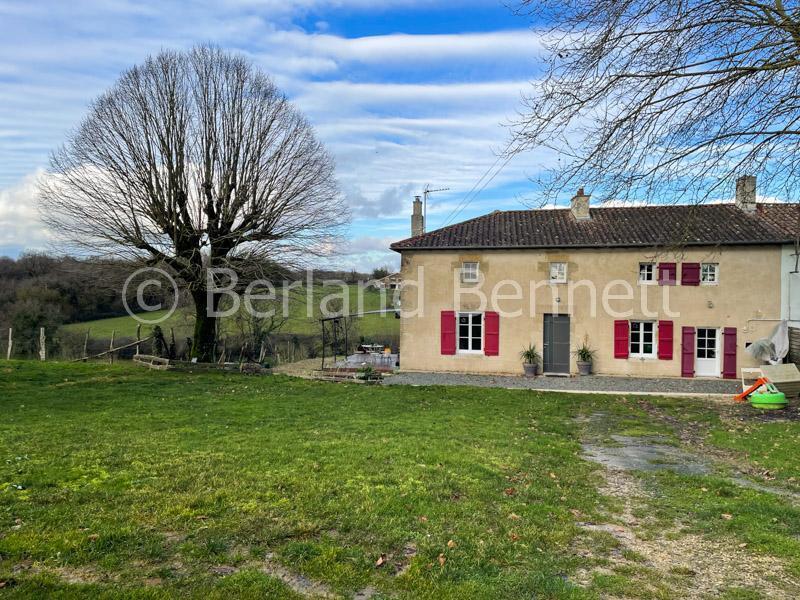 Stone property with outbuildings, land + undulating views – Nr Melle